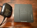 Cisco Spa 122 Ata Port Phone Adapter And Router With Ac. Fixed Price $40.00.